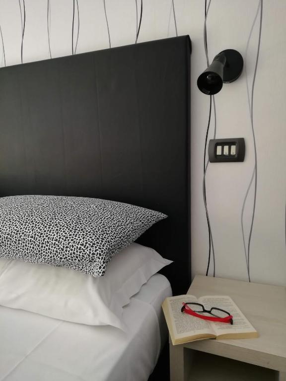Postel nebo postele na pokoji v ubytování Hotel Villa Perazzini