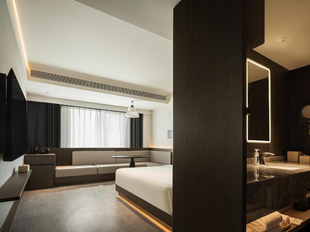 Ένα ή περισσότερα κρεβάτια σε δωμάτιο στο Atour Hotel Xi'an South Gate