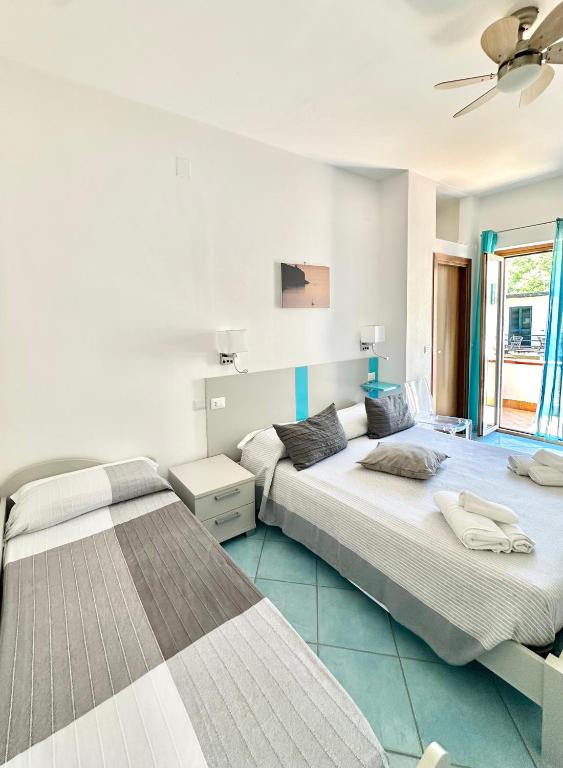 Postel nebo postele na pokoji v ubytování Belvedere Hotel-B&B