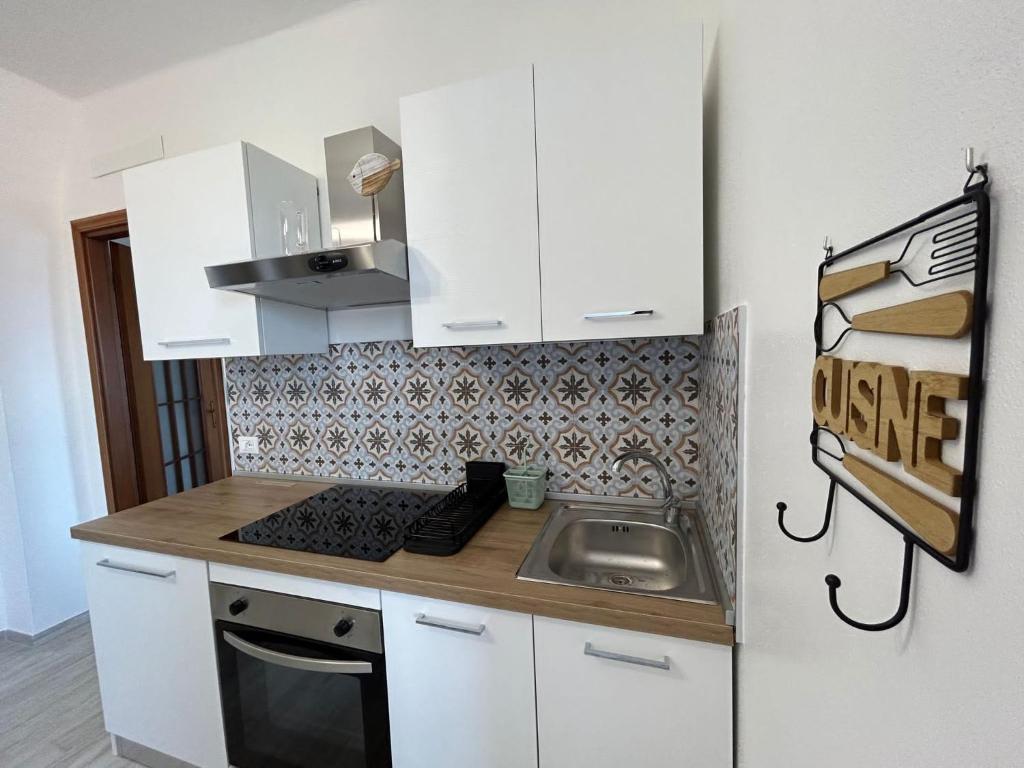 Кухня или мини-кухня в Casa Vacanze Merletto
