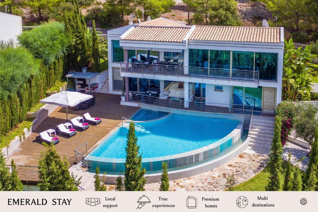an aerial view of a house with a swimming pool at Villa Rockstar, Alcudia - by EMERALD STAY in Alcudia