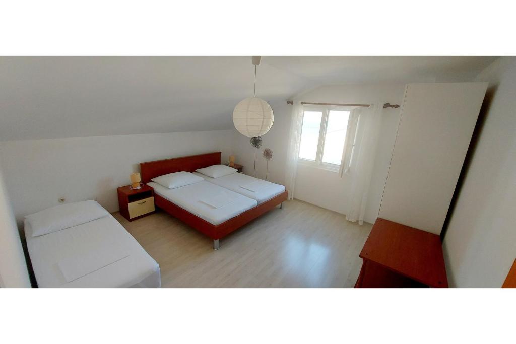 Postel nebo postele na pokoji v ubytování House Katarina