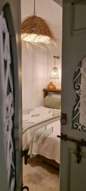 Postel nebo postele na pokoji v ubytování Riad Amaya