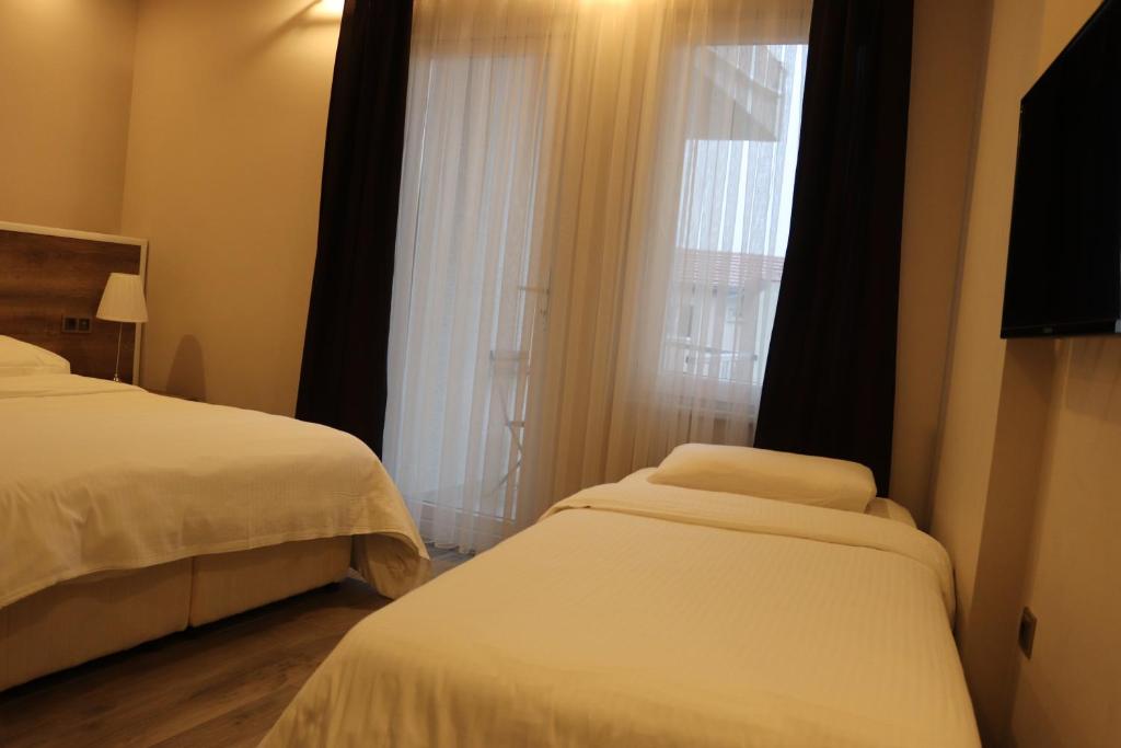 Кровать или кровати в номере Yankı Hotel