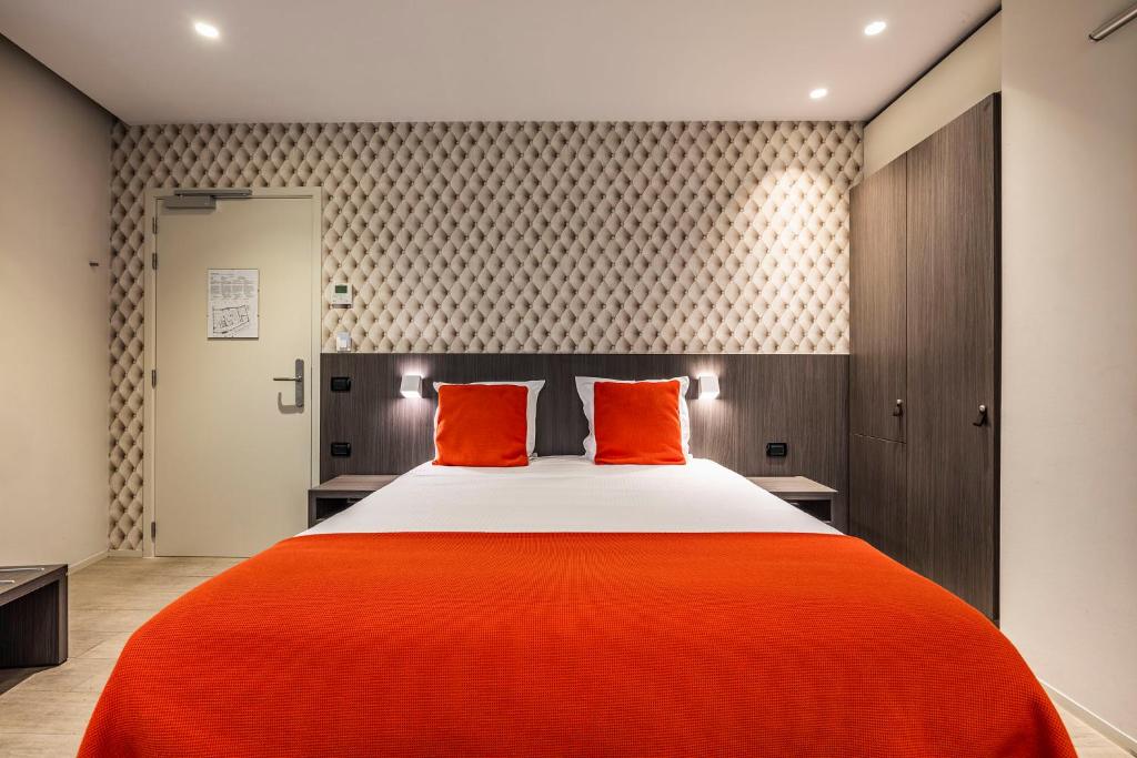 Postel nebo postele na pokoji v ubytování Square Hotel