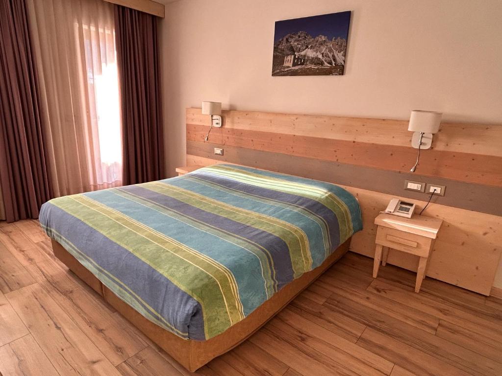 Łóżko lub łóżka w pokoju w obiekcie Hotel Centrale