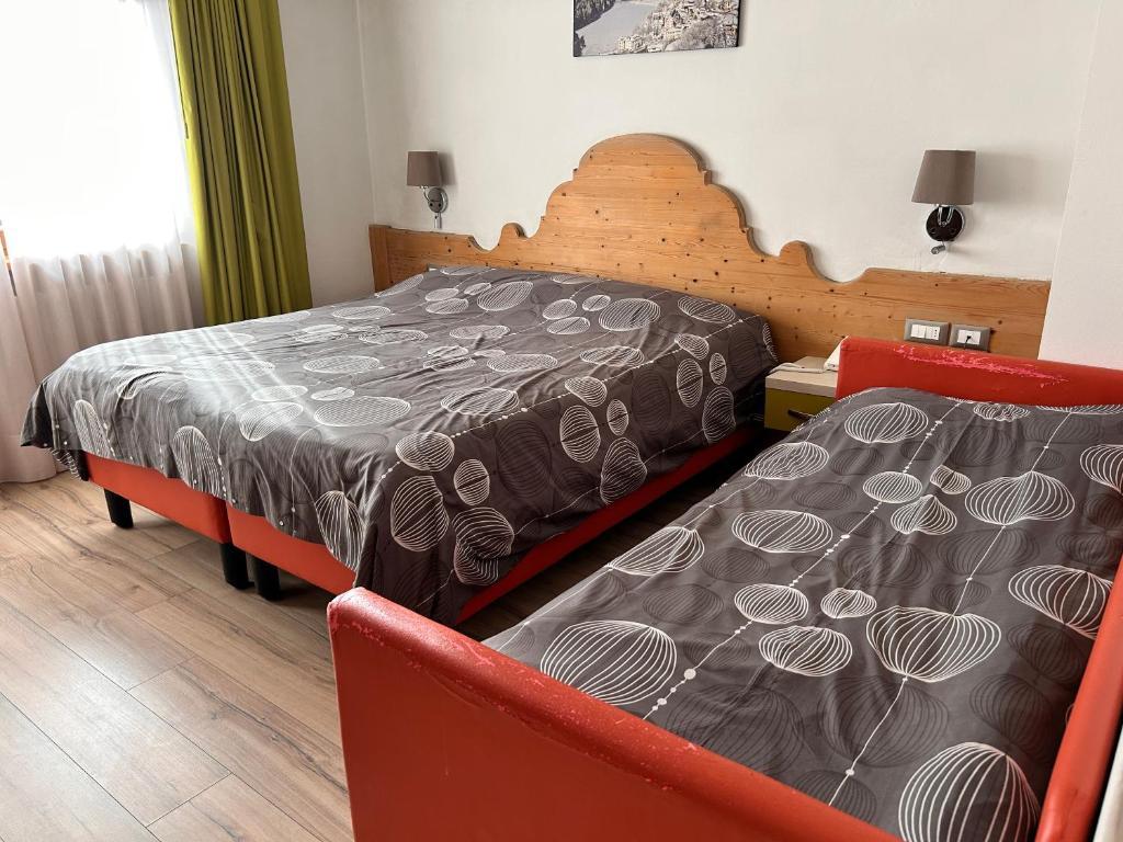 Łóżko lub łóżka w pokoju w obiekcie Hotel Centrale