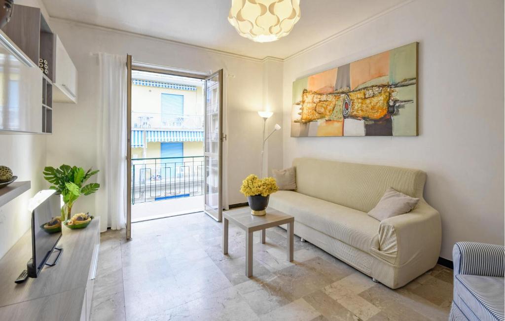a living room with a couch and a table at 2 Bedroom Lovely Apartment In Moneglia in Moneglia
