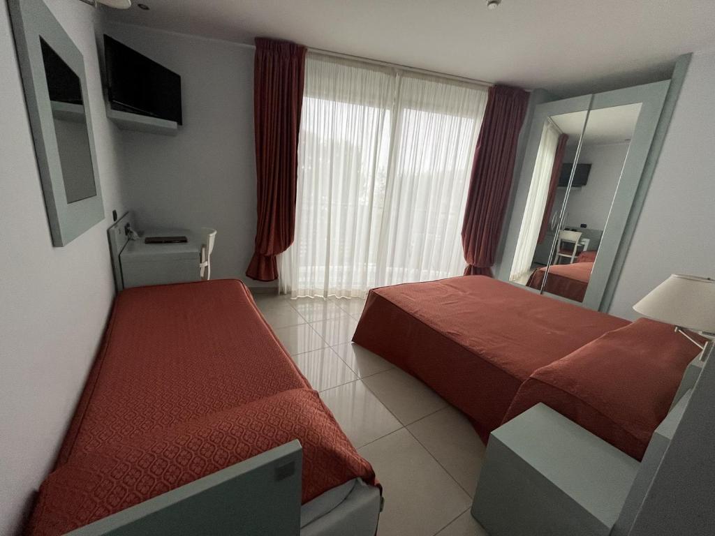 Postel nebo postele na pokoji v ubytování Hotel Eden Gigli