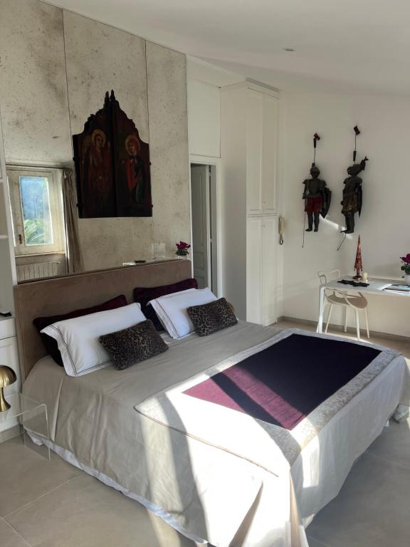 a bedroom with a large bed in a room at Domus Orestea Luxury Suites in Palermo