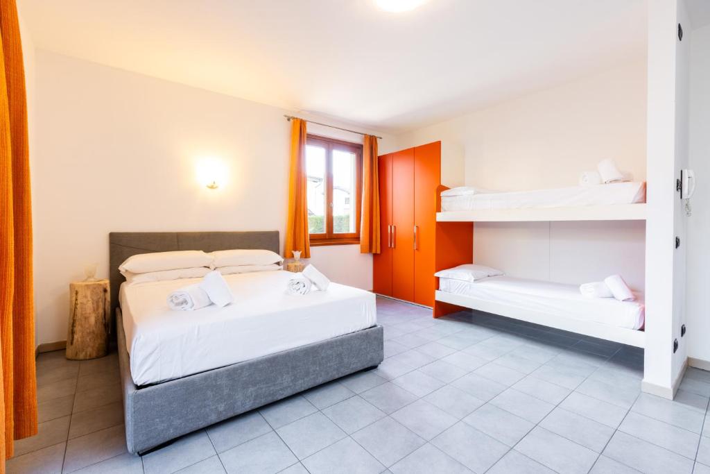 Postel nebo postele na pokoji v ubytování Spluga "Relax & Apartaments" by Alfio Colombo