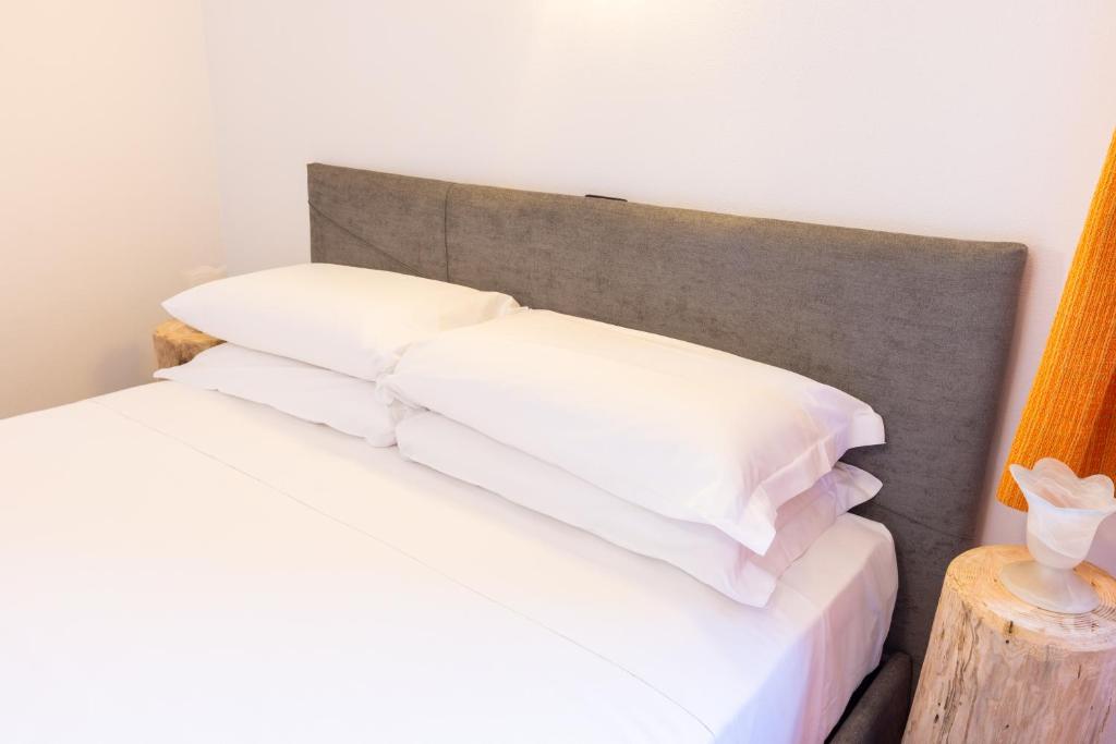 Postel nebo postele na pokoji v ubytování Spluga "Relax & Apartaments" by Alfio Colombo
