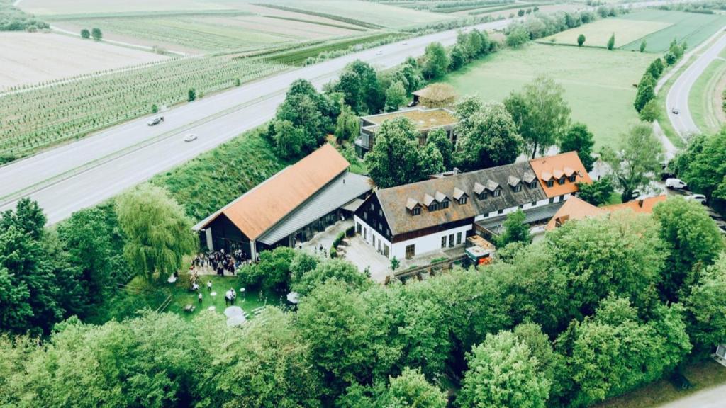 an aerial view of a large house in a field at Hotel Waldvogel in Leipheim