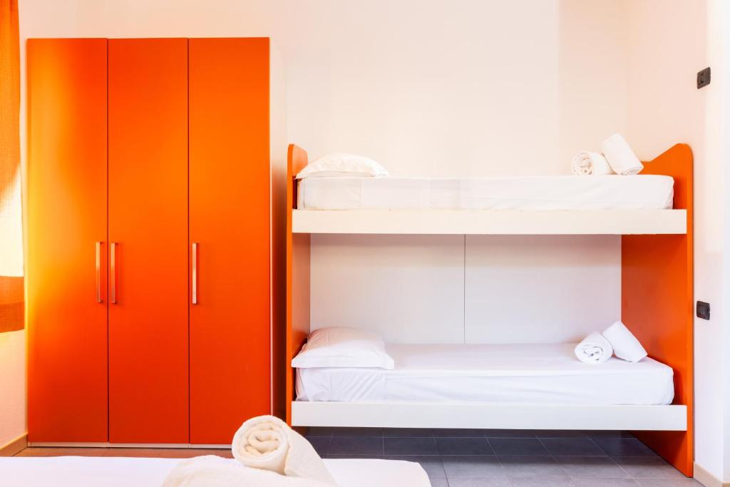 Postel nebo postele na pokoji v ubytování Spluga "Relax & Apartaments" by Alfio Colombo