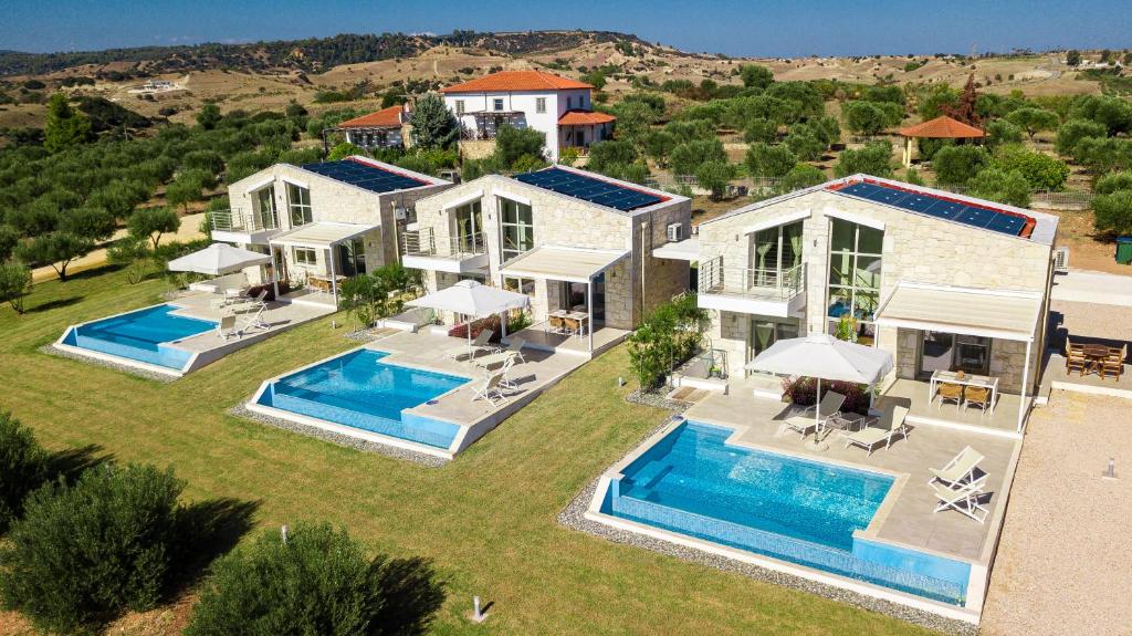 an aerial view of a house with two swimming pools at Nikiti Dream Villas in Nikiti