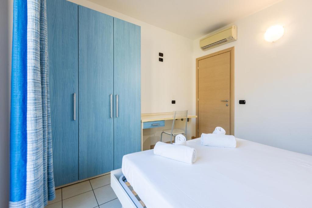Postel nebo postele na pokoji v ubytování Spluga "Relax & Apartaments" by Alfio Colombo