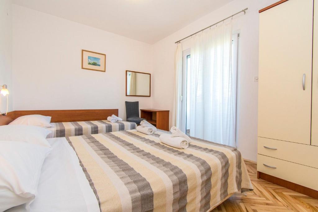 Posteľ alebo postele v izbe v ubytovaní Apartment Ivo