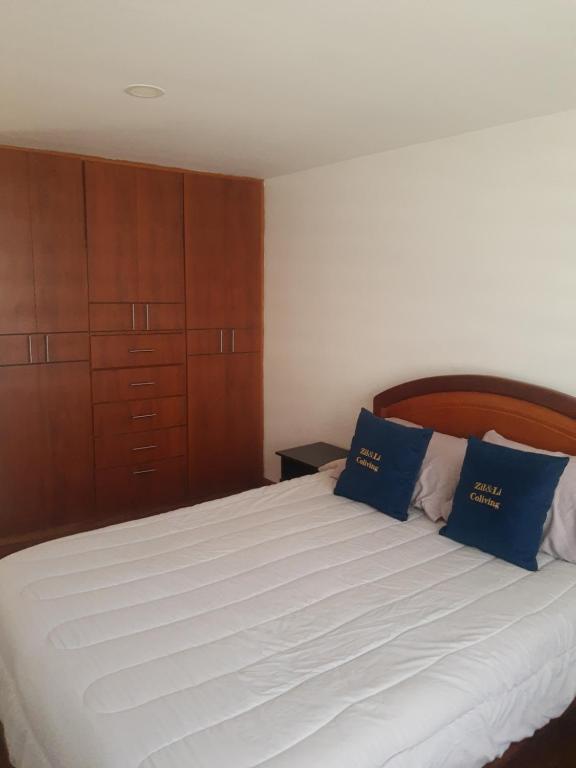 En eller flere senge i et værelse på Cálida Casa Zil&Li coliving Tunja