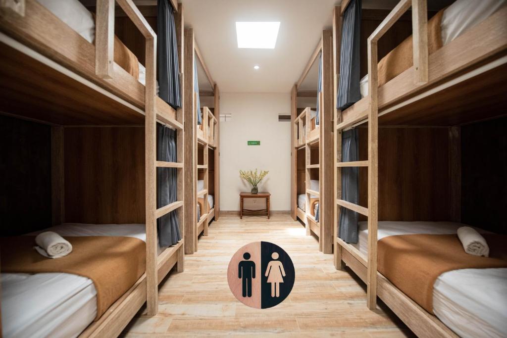 Postel nebo postele na pokoji v ubytování Pepitu Dormitory By Sandat