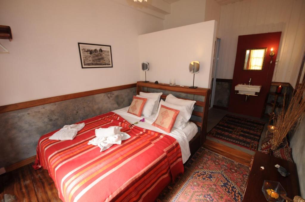Postel nebo postele na pokoji v ubytování The Colonial Guest House