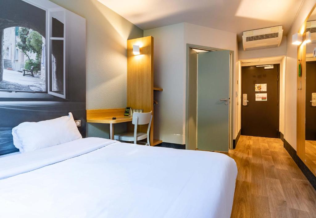 Postel nebo postele na pokoji v ubytování B&B HOTEL Valence Sud