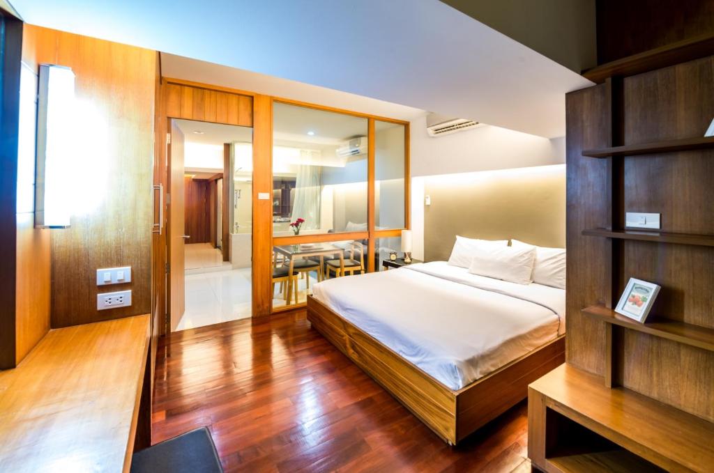 Postel nebo postele na pokoji v ubytování Laemtong Serviced Apartment