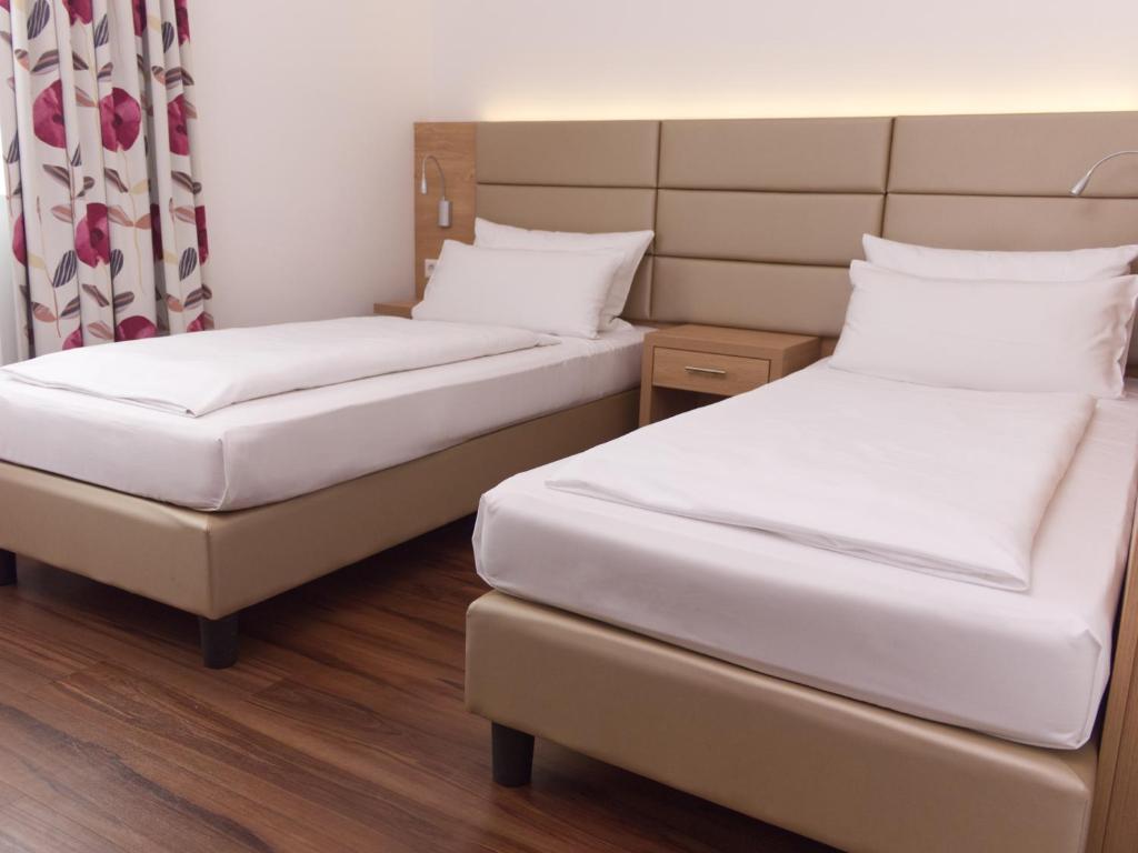 Postel nebo postele na pokoji v ubytování Hotel Wübbel