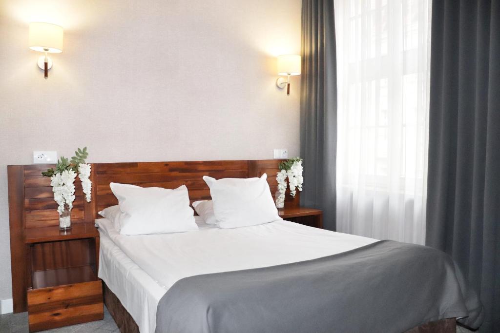 Posteľ alebo postele v izbe v ubytovaní Hotel Piast Wrocław Centrum