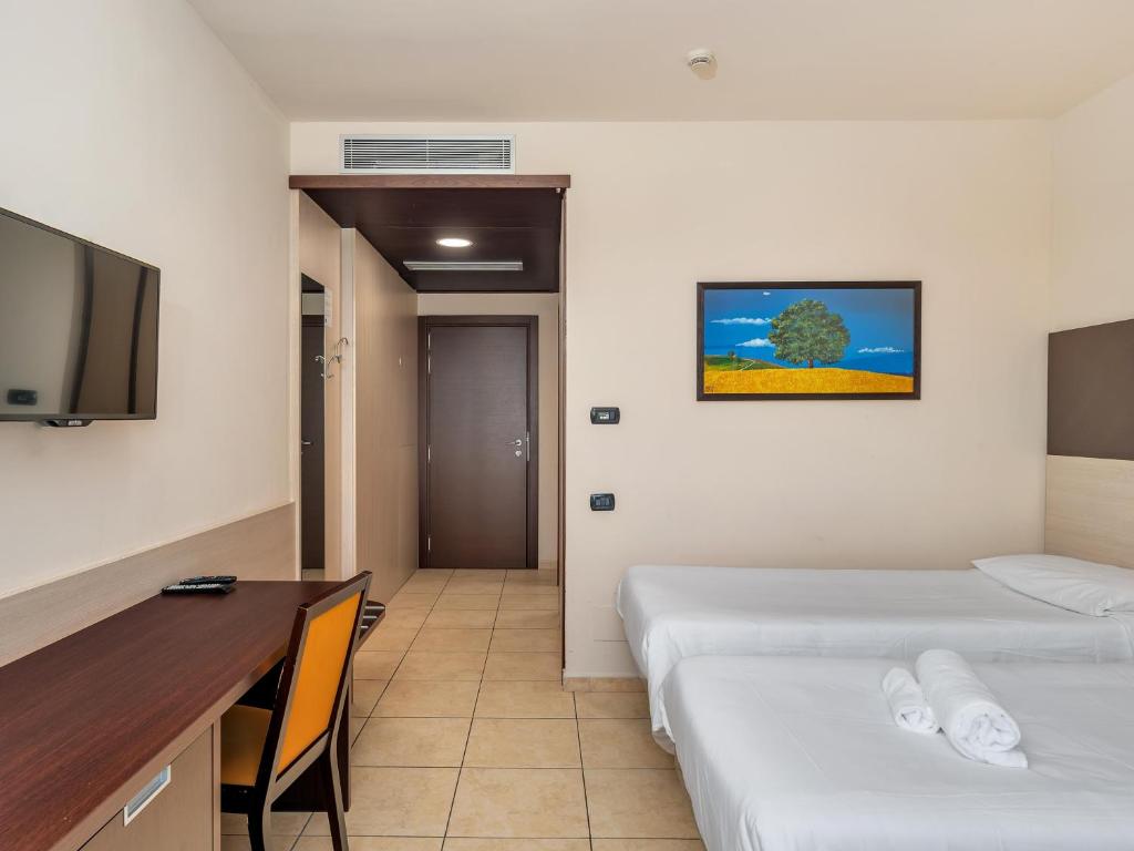 Postel nebo postele na pokoji v ubytování B&B HOTEL Settimo Torinese