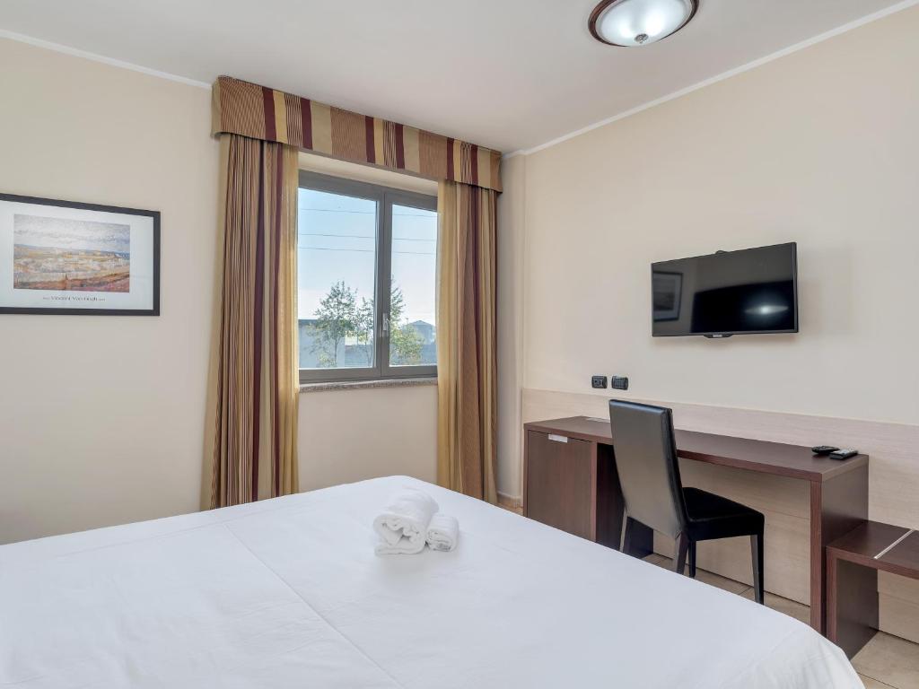 Postel nebo postele na pokoji v ubytování B&B HOTEL Settimo Torinese