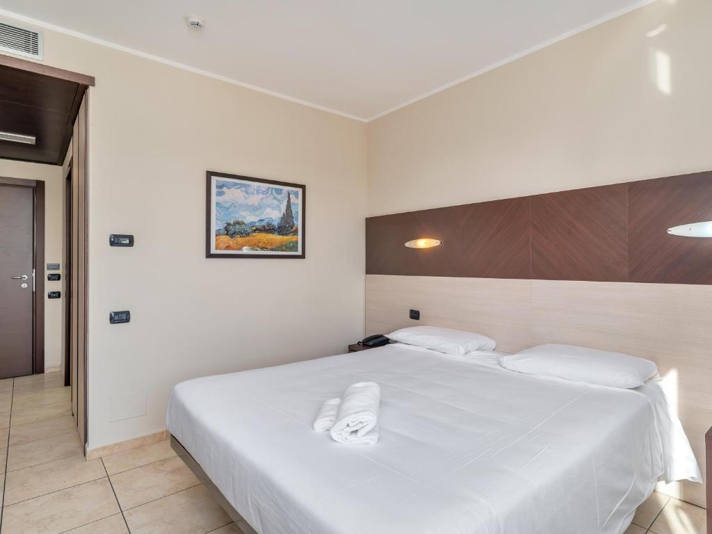 Postel nebo postele na pokoji v ubytování B&B HOTEL Settimo Torinese