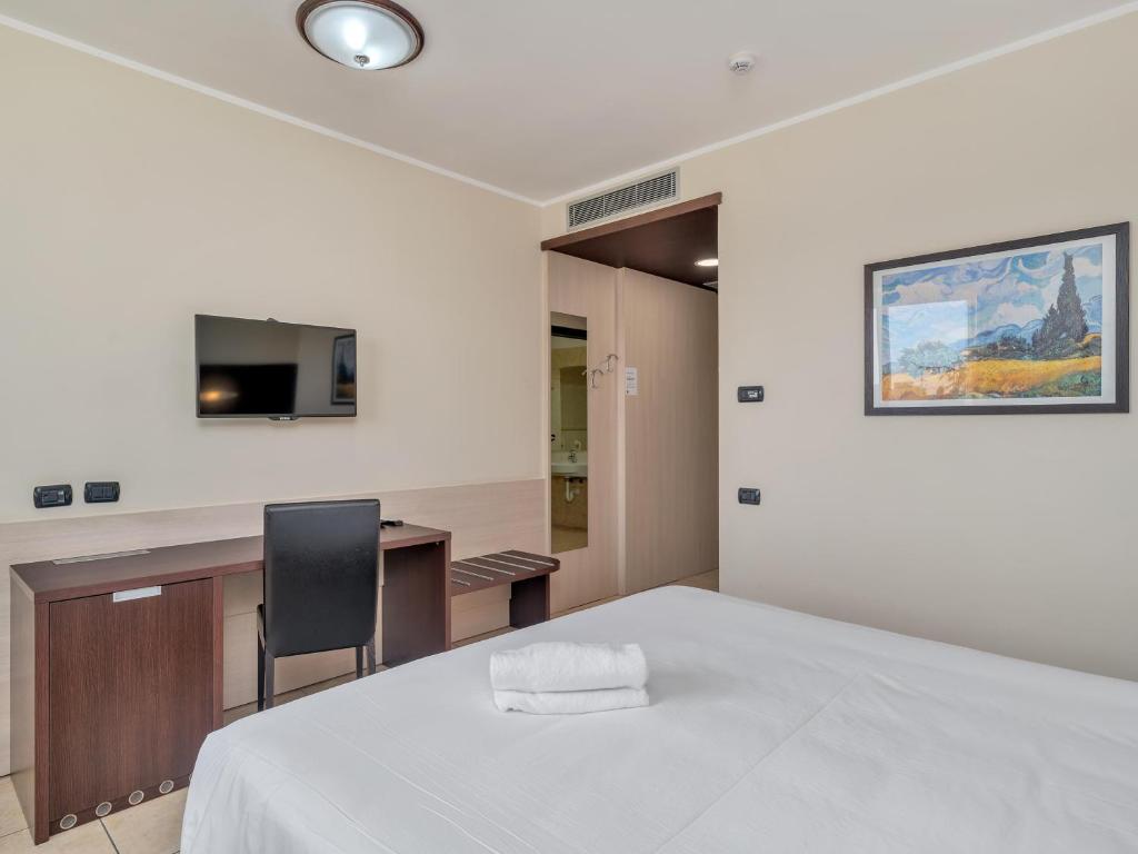 Postel nebo postele na pokoji v ubytování B&B HOTEL Settimo Torinese