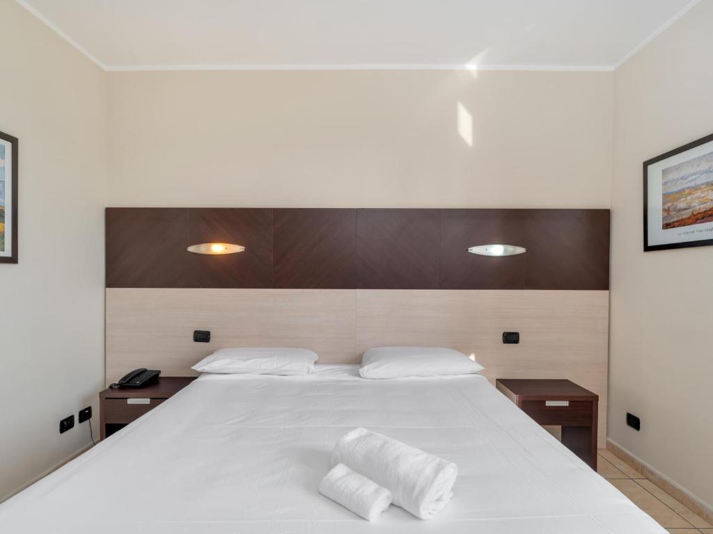 Postel nebo postele na pokoji v ubytování B&B HOTEL Settimo Torinese