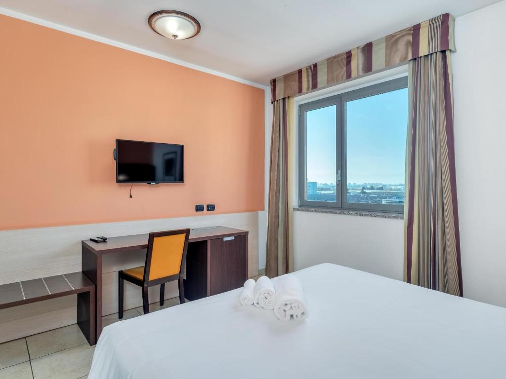 TV a/nebo společenská místnost v ubytování B&B HOTEL Settimo Torinese