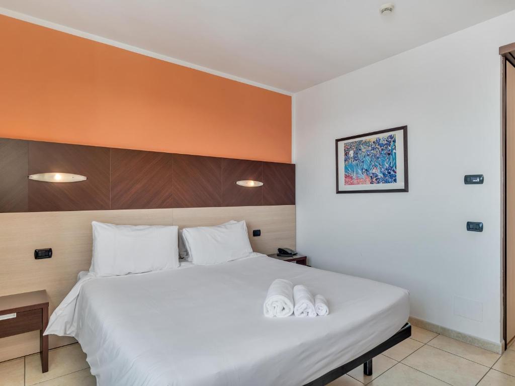Postel nebo postele na pokoji v ubytování B&B HOTEL Settimo Torinese