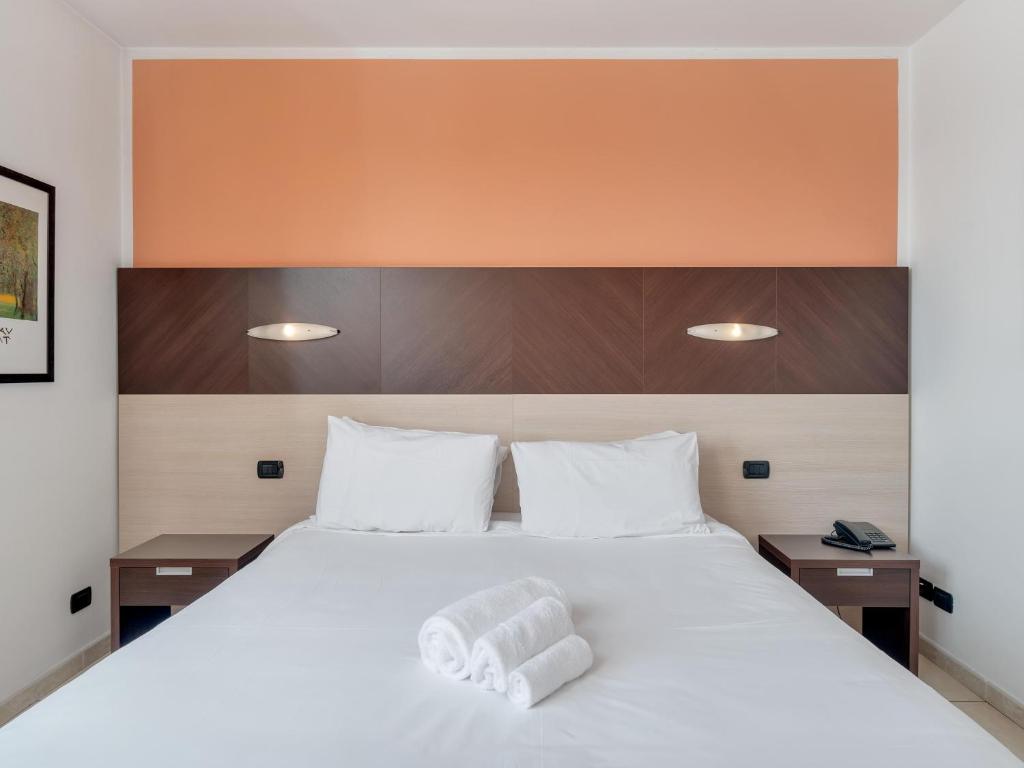 Postel nebo postele na pokoji v ubytování B&B HOTEL Settimo Torinese