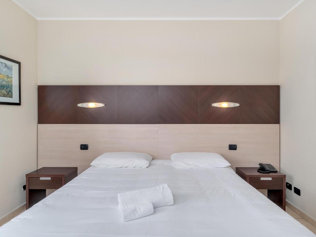 Postel nebo postele na pokoji v ubytování B&B HOTEL Settimo Torinese