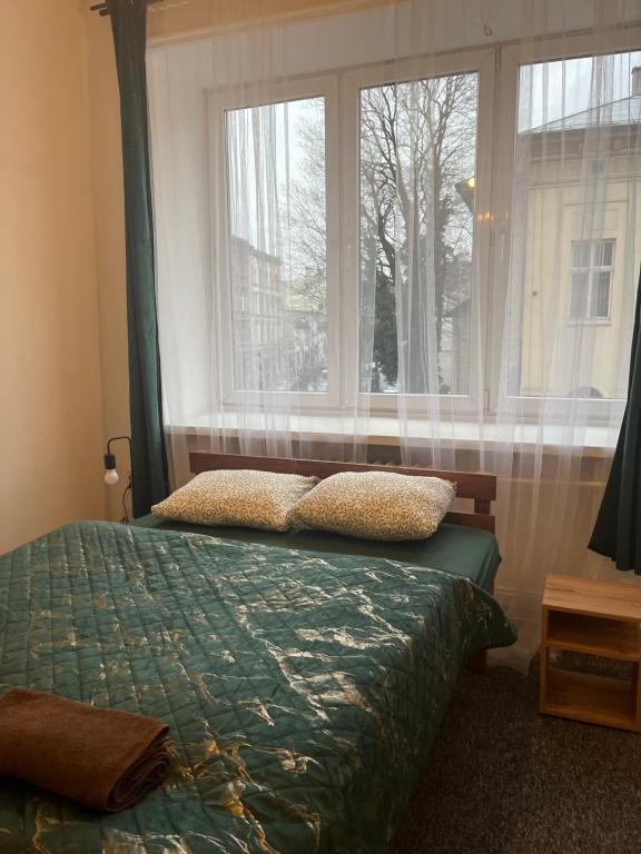 Postel nebo postele na pokoji v ubytování Tom Hostel