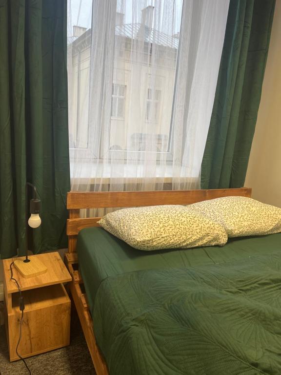 Postel nebo postele na pokoji v ubytování Tom Hostel