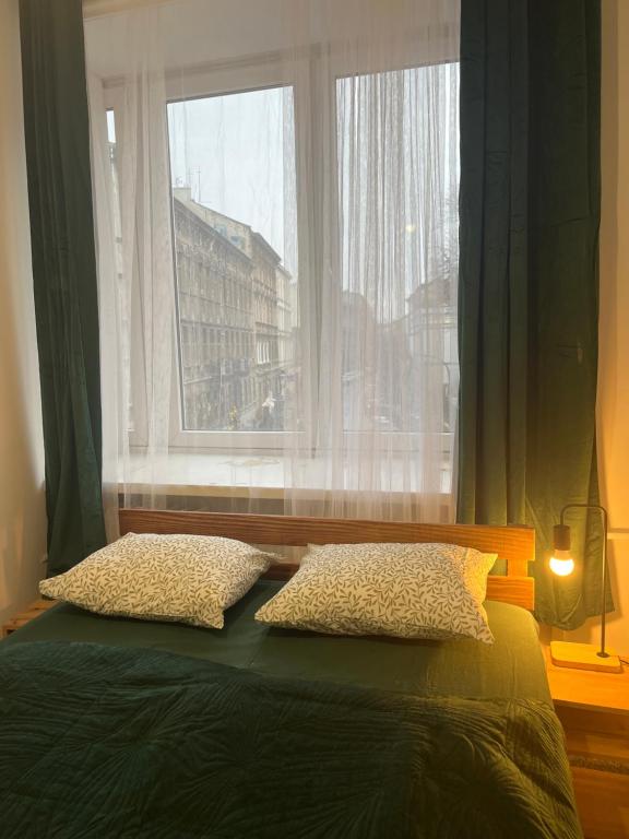 Postel nebo postele na pokoji v ubytování Tom Hostel