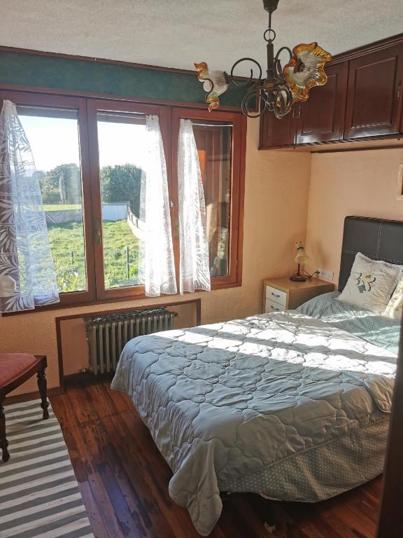 Cama o camas de una habitación en Chalet céntrico costero en Gijón