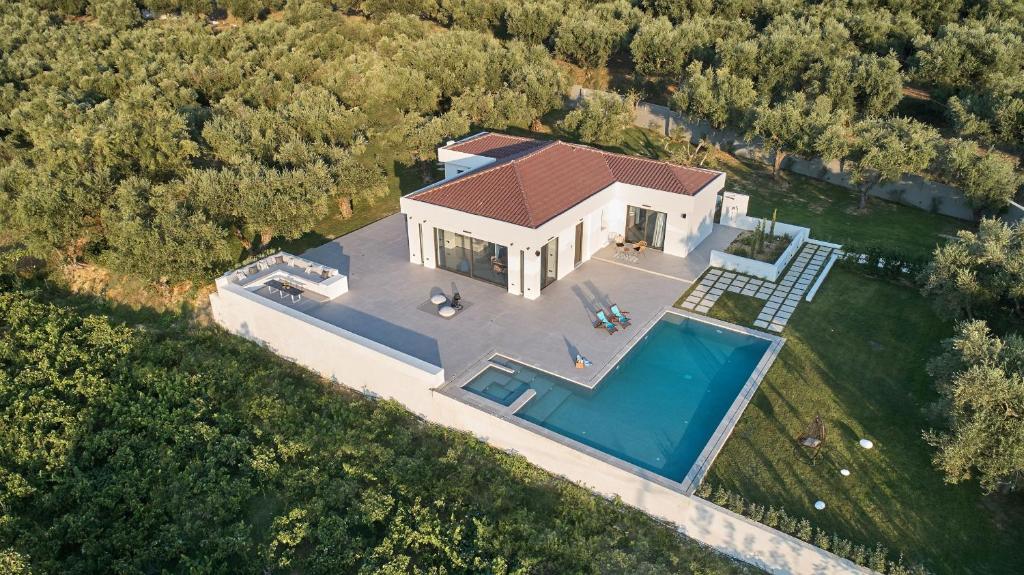 an overhead view of a house with a swimming pool at Drallos Luxury Villa - Private Heated Pool & Large Groups, by ZanteWize in Alikanas