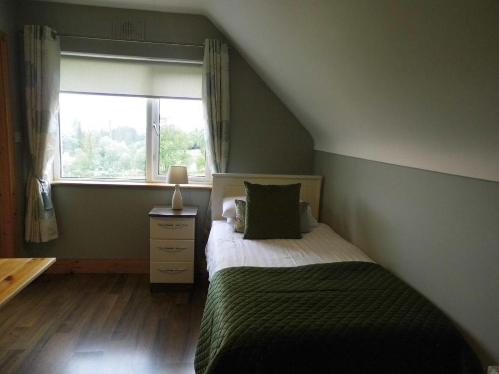 Postel nebo postele na pokoji v ubytování Eas Dun Lodge