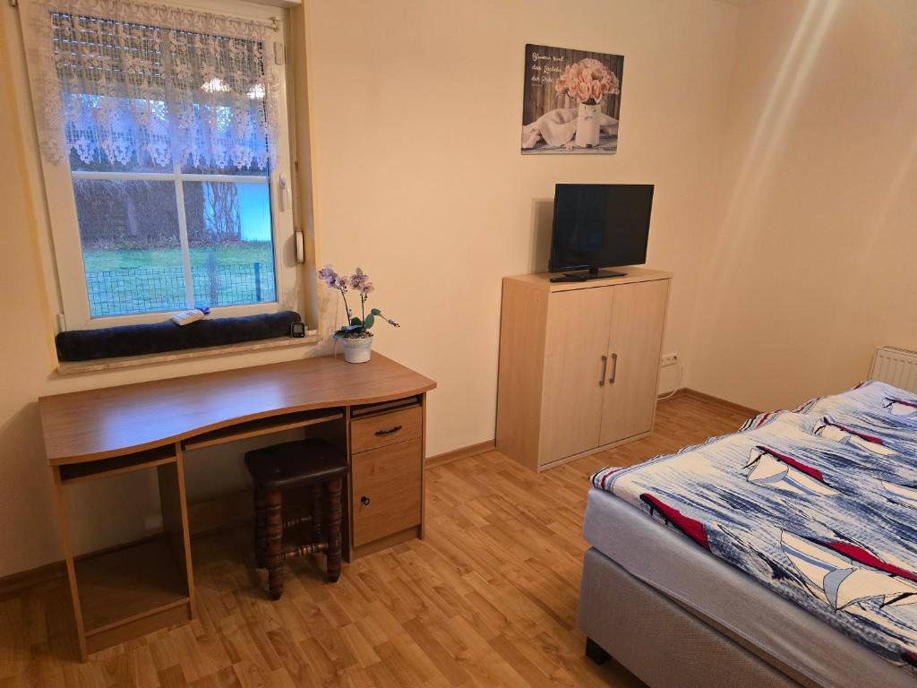 Postel nebo postele na pokoji v ubytování Ferienhaus 1 Wiesenperle