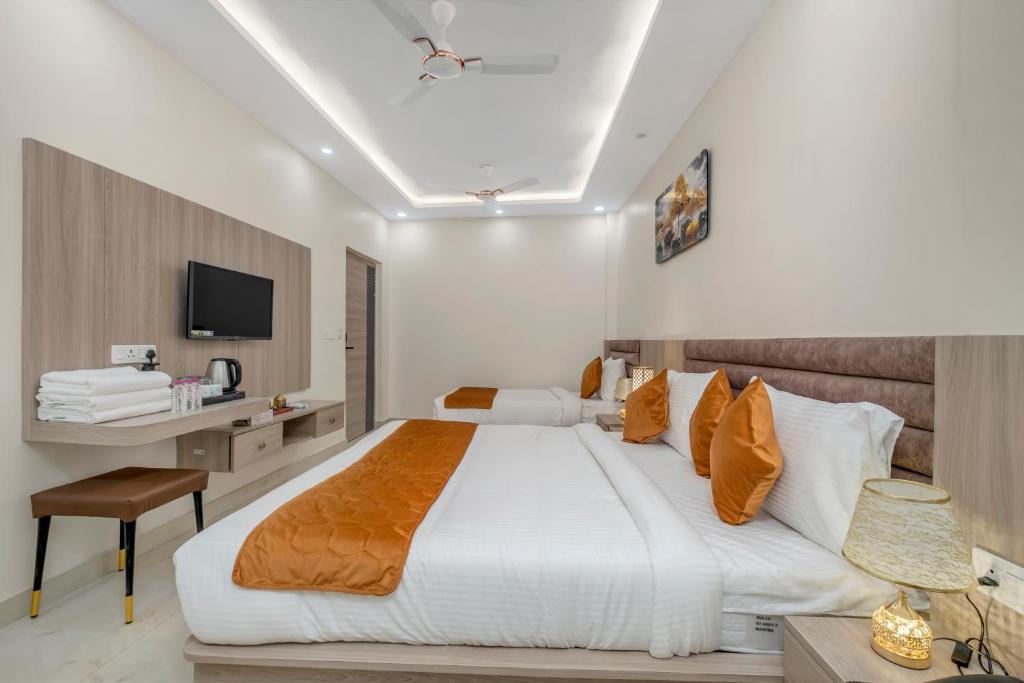 Postel nebo postele na pokoji v ubytování Hotel Sudarshan