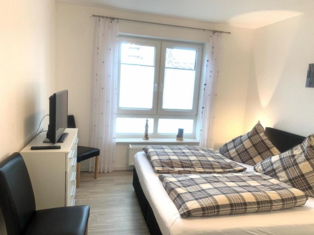 Postel nebo postele na pokoji v ubytování Wohnung 57