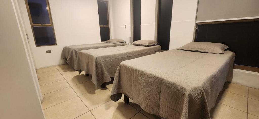 Postel nebo postele na pokoji v ubytování Apart Hotel Azimut Iquique