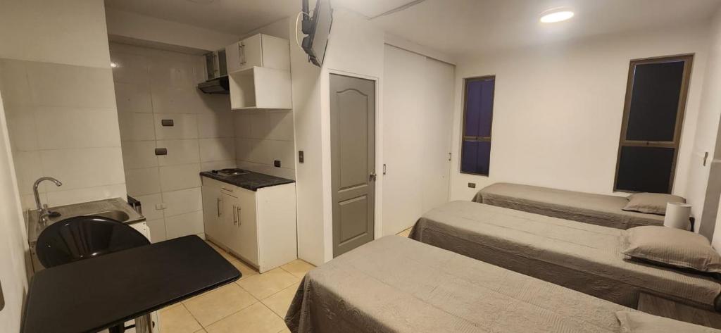 Postel nebo postele na pokoji v ubytování Apart Hotel Azimut Iquique