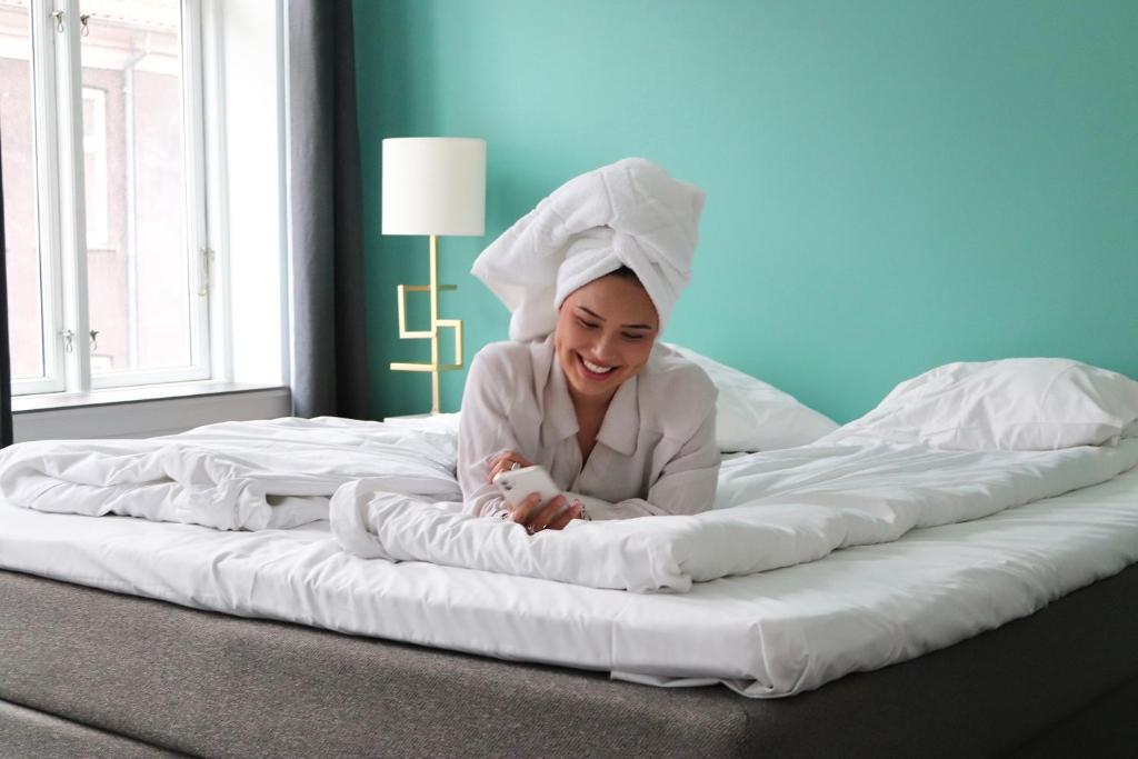 Postel nebo postele na pokoji v ubytování A Hotels City