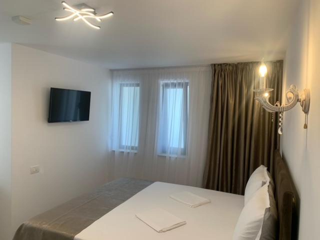 TV a/nebo společenská místnost v ubytování Hotel Nalba-Dalia Jupiter